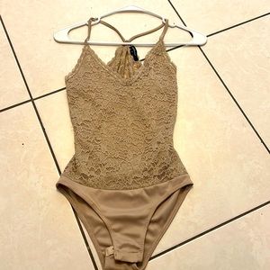 Tan body suit